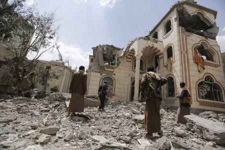 Guards walk on the rubble of the house of Brigadier Khaled al-Anduli, an army commander loyal to the Houthi movement, after it was hit by Saudi-led air strikes in Yemen's capital Sanaa, July 6, 2015.PHOTO BY  REUTERS/Khaled Abdullah