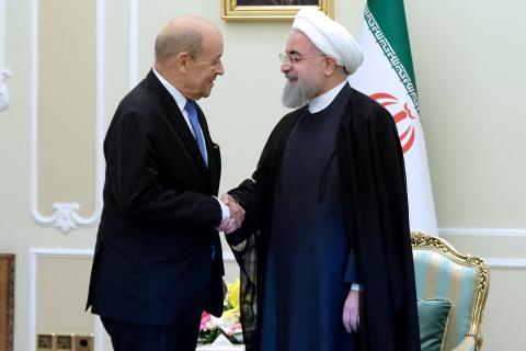 Iranian President Hassan Rouhani shakes hands with French Foreign Affairs Minister Jean-Yves Le Drian, in Tehran, Iran, March 5, 2018. PHOTO BY REUTERS/President.ir