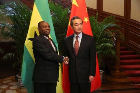 China's Foreign Minister Wang Yi and Sao Tome and Principe's Foreign Minister Urbino Botelho attend a signing ceremony for China and Sao Tome and Principe to establish official relations, in Beijing, China, December 26, 2016. PHOTO BY REUTERS/China Daily