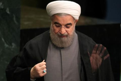Iran's President Hassan Rouhani adjusts his clothes after he addressed the 71st United Nations General Assembly in Manhattan, New York, U.S., September 22, 2016. PHOTO BY REUTERS/Carlo Allegri