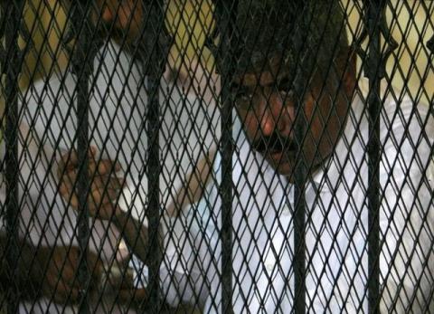 Hesham Talaat Moustafa, former chairman of the Talaat Moustafa Group, stands inside a cage at a court in Cairo, Egypt, June 25, 2009. PHOTO BY REUTERS/Asmaa Waguih