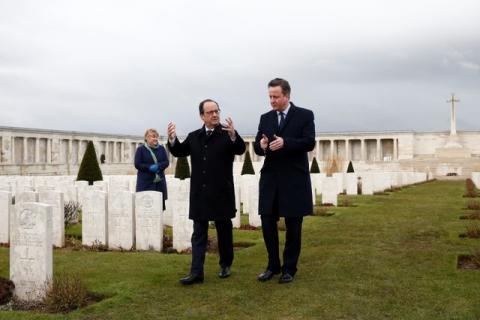 French President Francois Hollande (L) and Britain's Prime Minister David Cameron speak as they pay their respects at the Pozieres British Memorial as part of a Franco-British summit in Pozieres, near Amiens, northern France, March 3, 2016. PHOTO BY REUTERS/Yoan Valat