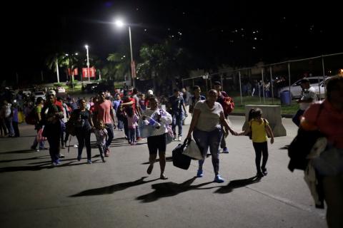 Hondurans take part in a new caravan of migrants, set to head to the United States, as they leave San Pedro Sula, Honduras, January 14, 2019. PHOTO BY REUTERS/Jorge Cabrera