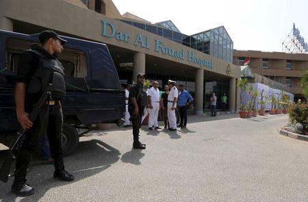 Egyptian police personnel stand guard outside Dar Al Fouad Hospital, where injured tourists who were mistakenly targeted in a military operation "chasing terrorist elements" are recovering, in Cairo, Egypt, September 14, 2015. PHOTO BY REUTERS/Mohamed Abd El Ghany
