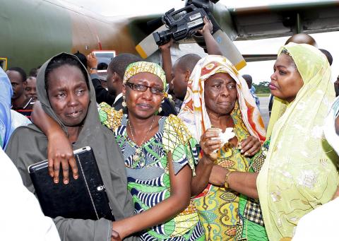 Freed hostages react as they arrive at the Nsimalen International Airport in Yaounde, November 26, 2014. PHOTO BY REUTERS/Stringer