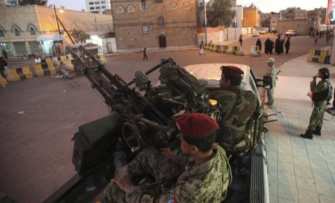 Houthi fighters in army uniform outside the presidential palace in Sanaa, February 6, 2015. PHOTO BY REUTERS/Mohamed al-Sayaghi