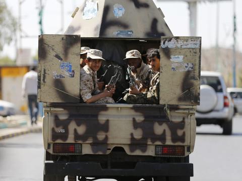 Houthi fighters ride a patrol vehicle outside a hotel hosting U.N.-sponsored negotiations on a political settlement for Yemen's crisis in Sanaa, February 19, 2015. PHOTO BY REUTERS/Khaled Abdullah