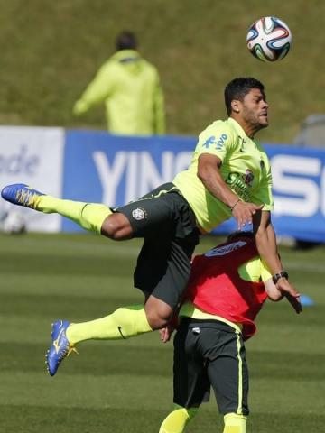 Brazil's national soccer team player Hulk jumps for the ball during a training session in Teresopolis, near Rio de Janeiro