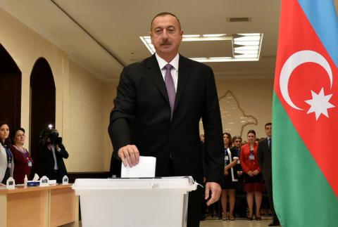 Azerbaijan's President Ilham Aliyev casts his vote during a referendum on extending presidential terms in Baku, Azerbaijan, September 26, 2016. PHOTO BY REUTERS/AZERTAC/Vugar Amrullayev