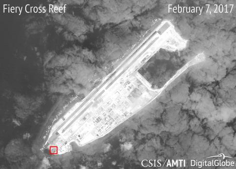 A satellite image shows what CSIS Asia Maritime Transparency Initiative says appears to be concrete structures with retractable roofs on the artificial island Fiery Cross reefs in the South China Sea in this image released on February 22, 2017. PHOTO BY REUTERS/Courtesy CSIS Asia Maritime Transparency Initiative
