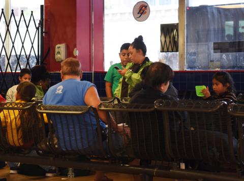 Undocumented immigrants wait at a Greyhound bus station after being released from detention in San Antonio, Texas, U.S., July 13, 2018. PHOTO BY REUTERS/Callaghan O'Hare