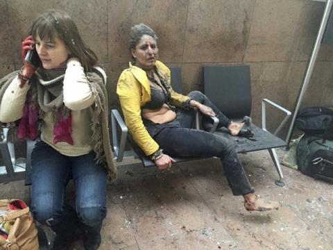 Injured people are seen at the scene of explosions at Zaventem airport near Brussels, Belgium, March 22, 2016. PHOTO BY REUTERS/Ketevan Kardava