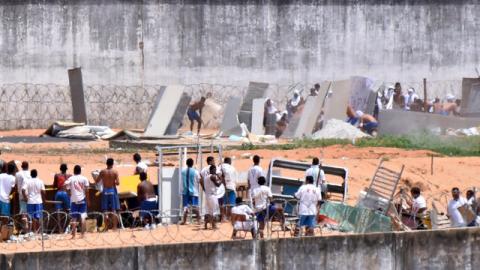 Inmates from different gangs (top and bottom) protect themselves during an uprising at Alcacuz prison in Natal, Rio Grande do Norte state, Brazil, January 17, 2017. PHOTO BY REUTERS/Josemar Goncalves