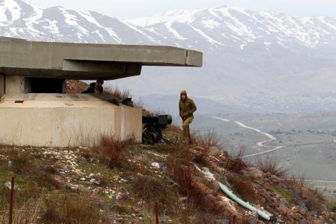 An Israeli soldier walks near a military post close to the Druze village of Majdal Shams in the Israeli-occupied Golan Heights, Israel, February 10, 2018. PHOTO BY REUTERS/Ammar Awad