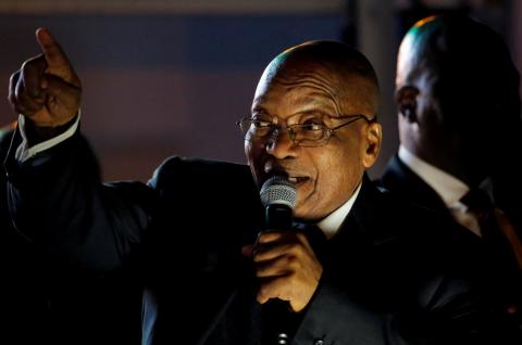 South Africa's President Jacob Zuma celebrates with his supporters after he survived a no-confidence motion in parliament in Cape Town, South Africa, August 8, 2017. PHOTO BY REUTERS/Mike Hutchings