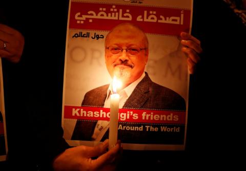 A demonstrator holds a poster with a picture of Saudi journalist Jamal Khashoggi outside the Saudi Arabia consulate in Istanbul, Turkey, October 25, 2018. PHOTO BY REUTERS/Osman Orsa