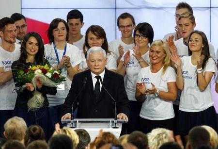 The leader of Poland's main opposition party Law and Justice (PiS) Jaroslaw Kaczynski addresses as his daughter Marta (L) looks on after the exit poll results are announced in Warsaw, Poland, October 25, 2015. PHOTO BY REUTERS/Pawel Kopczynski