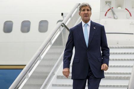 U.S. Secretary of State John Kerry steps off his plane after arriving at London' Stansted Airport for meetings on the ongoing Syrian crisis, on Friday, Sept. 18, 2015. PHOTO BY REUTERS/Evan Vucci