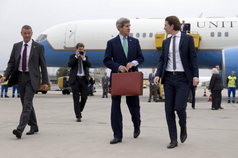 U.S. Secretary of State John Kerry (C) walks to his car with Austria's Foreign Minister Sebastian Kurz (R) as he arrives at Vienna International Airport, in Vienna 