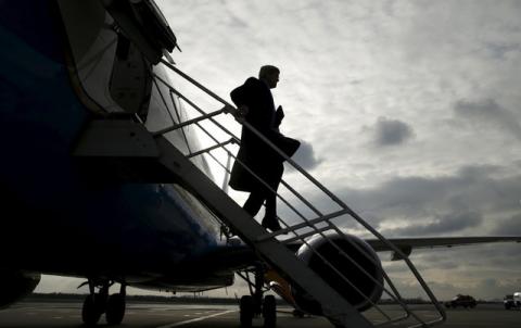 U.S. Secretary of State John Kerry steps from his plane upon his arrival in Vienna, Austria on what is expected to be "implementation day," the day the International Atomic Energy Agency (IAEA) verified that Iran has met all conditions under the nuclear deal, January 16, 2016. PHOTO BY REUTERS/Kevin Lamarque