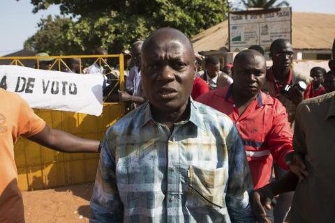 Presidential candidate Jose Mario Vaz leaves a polling station after voting in Bissau