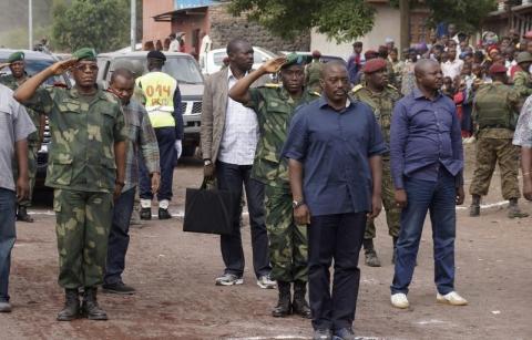 Democratic Republic of Congo's President Joseph Kabila (front C) stands for the national anthem along a street in Goma, a town in eastern Democratic Republic of the Congo, November 30, 2013. PHOTO BY REUTERS/Kenny Katombe