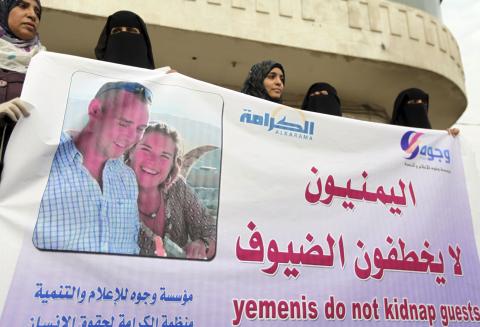 Journalists and human rights activists hold a banner during a protest to demand the release of journalist Judith Spiegel and her partner Boudewijn Berendsen