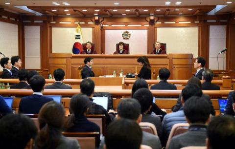 Lee Jin-Sung, Lee Jung-Mi and Kang Il-Won, judges of South Korea's Constitutional Court, sit on during a hearing into whether to confirm the impeachment of President Park Geun-Hye, at the Constitutional Court in Seoul, December 22, 2016. PHOTO BY REUTERS/JUNG YEON-JE