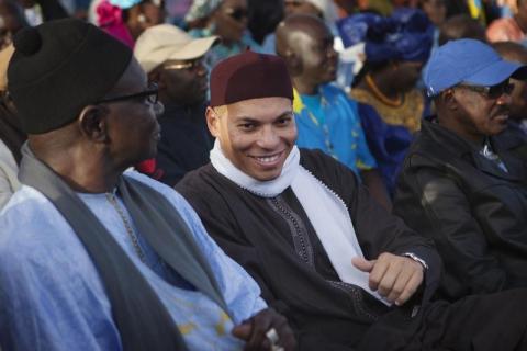 Karim Wade (C), son of Senegal's former president Abdoulaye Wade, attends a rally by his father's political party Parti Democratique Senegalais (PDS) in Dakar