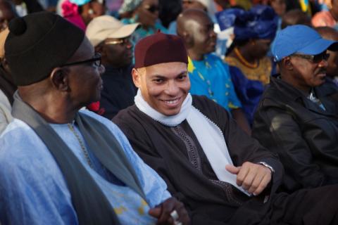 Karim Wade (C), son of Senegal's former president Abdoulaye Wade, attends a rally by his father's political party Parti Democratique Senegalais (PDS) in Dakar, December 6, 2012. PHOTO BY REUTERS/Joe Penney
