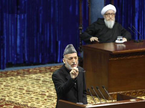 Afghan President Hamid Karzai speaks during the opening of the Loya Jirga, or grand council, in Kabul