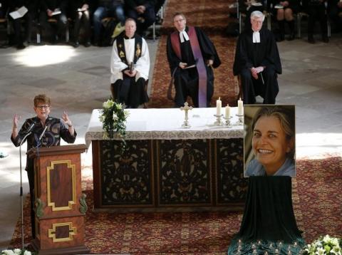 Associated Press Senior Vice President and Executive Editor Kathleen Carrol (L) speaks during the funeral of German photojournalist Anja Niedringhaus inside Corvey Abbey in Hoexter, April 12, 2014. PHOTO BY REUTERS/Frank Augstein