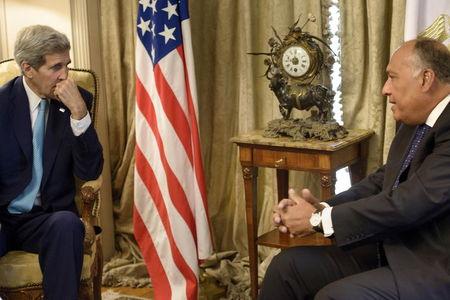 U.S. Secretary of State John Kerry (L) speaks with Egyptian Foreign Minister Sameh Shukri before a meeting at the Ministry of Foreign Affairs in Cairo August 2, 2015. PHOTO BY REUTERS/Brendan Smialowski