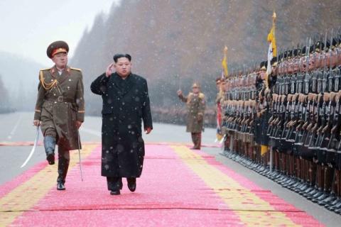 North Korean leader Kim Jong Un salutes during a visit to the Ministry of the People's Armed Forces on the occasion of the new year, in this undated photo released by North Korea's Korean Central News Agency (KCNA), January 10, 2016. PHOTO BY REUTERS/KCNA