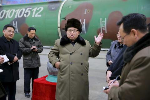 North Korean leader Kim Jong Un meets scientists and technicians in the field of researches into nuclear weapons in this undated photo released by North Korea's Korean Central News Agency (KCNA) in Pyongyang, March 9, 2016. PHOTO BY REUTERS/KCNA