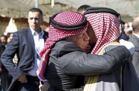 Jordan's King Abdullah offers his condolences to Safi al-Kasaesbeh, the father of Jordanian pilot Muath al-Kasaesbeh, at the headquarters of the family's clan in the city of Karak, February 5, 2015. PHOTO BY REUTERS/Petra News Agency