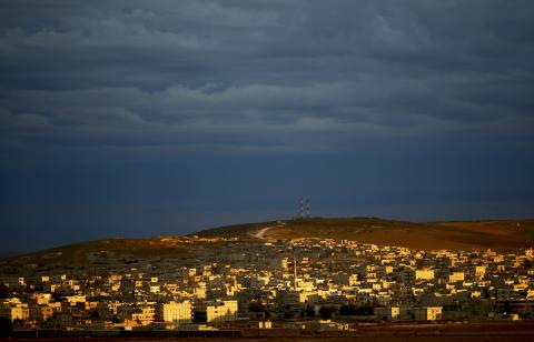 A general view of the Syrian town of Kobani is pictured from near the Mursitpinar border crossing, on the Turkish-Syrian border in the southeastern town of Suruc, October 19, 2014. PHOTO BY REUTERS/Kai Pfaffenbach