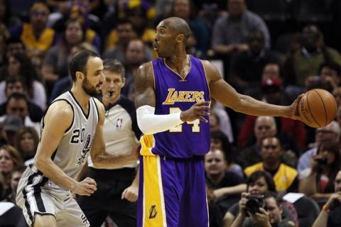 Los Angeles Lakers shooting guard Kobe Bryant (24) looks to pass against San Antonio Spurs shooting guard Manu Ginobili (20) during the first half at AT&T Center, Dec 12, 2014; San Antonio, TX, USA. PHOTO BY Soobum Im-USA TODAY Sports.
