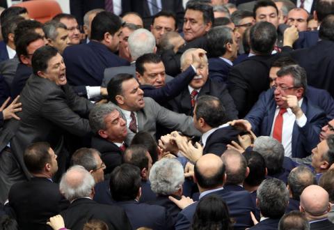 Lawmakers from ruling AK Party and the main opposition Republican People's Party (CHP) scuffle during a debate on the proposed constitutional changes at the Turkish Parliament in Ankara, Turkey, January 11, 2017. PHOTO BY REUTERS/Stringer