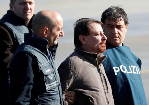 Former Italian leftist guerrilla Cesare Battisti is escorted by police from Ciampino airport in Rome, Italy, January 14, 2019. PHOTO BY REUTERS/Max Rossi