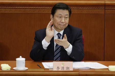 China's Vice President Li Yuanchao claps during the opening session of Chinese People's Political Consultative Conference (CPPCC) at the Great Hall of the People in Beijing, March 3, 2015. PHOTO BY REUTERS/Jason Lee
