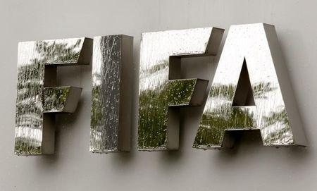 Water flows over the FIFA logo in front of the FIFA headquarters during heavy rainfall in Zurich, July 22, 2011. PHOTO BY REUTERS/Arnd Wiegmann
