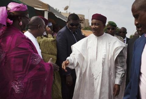Niger's President Mahamadou Issoufou shakes hands with government officials at the opening ceremony of a flyover road built by Chinese company GSCI in Niamey, September 17, 2013. PHOTO BY REUTERS/Joe Penney