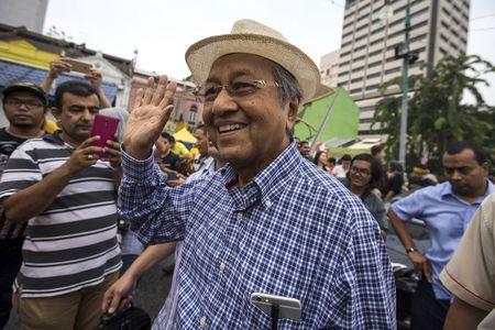 Former Malaysian Prime Minister Mahathir Mohamad (C) waves as he attends a rally organised by pro-democracy group "Bersih" (Clean) near Central Market in Malaysia's capital city of Kuala Lumpur, August 30, 2015. PHOTO BY REUTERS/Athit Perawongmetha