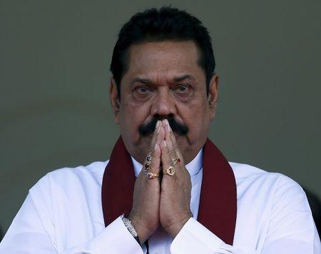 Sri Lanka's former president Mahinda Rajapaksa, who is contesting in the upcoming general election, prays during the launch ceremony of his manifesto, in Colombo, July 28, 2015. PHOTO BY REUTERS/Dinuka Liyanawatte