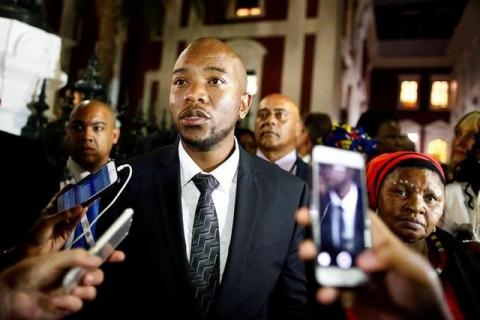 Leader of the Democratic Alliance Mmusi Maimane speaks with members of the media after leaving President Jacob Zuma's State of the Nation Address (SONA) to a joint sitting of the National Assembly and the National Council of Provinces in Cape Town, South Africa, February 9, 2017. PHOTO BY REUTERS/Nic Bothma