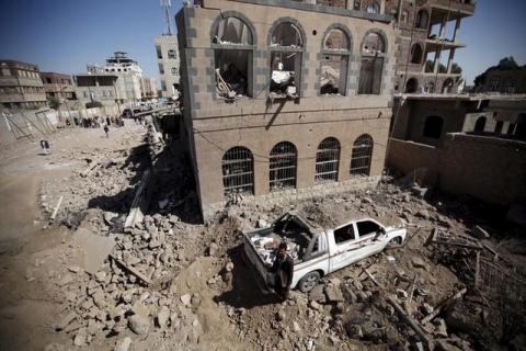 A man stands at the site of Saudi-led air strikes in Yemen's capital Sanaa, October 28, 2015. PHOTO BY REUTERS/Khaled Abdullah