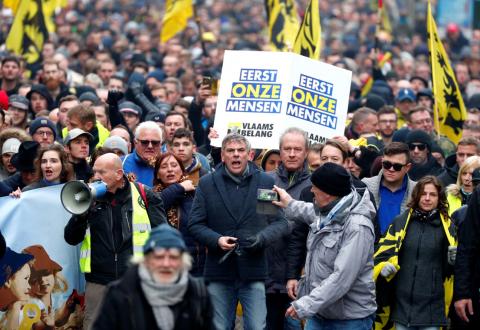 Flemish right-wing party President Filip Dewinter attends a protest against Marrakesh Migration Pact in Brussels, Belgium, December 16, 2018. Banner reads "People first". PHOTO BY REUTERS/Francois Lenoir