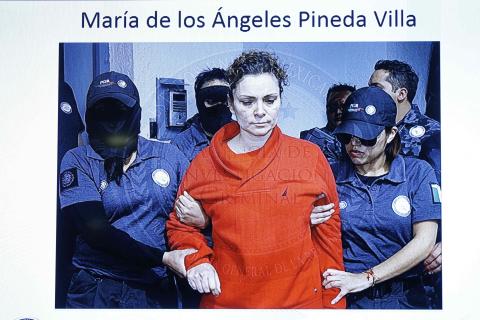 Maria de los Angeles Pineda Villa, the wife of former mayor of Iguala, Jose Luis Abarca, is seen displayed on a television screen during a news conference, while she is transferred to a prison in Tepic, at Nayarit state, in Mexico City, January 5, 2015. PHOTO BY REUTERS/Mexico's Attorney General's Office
