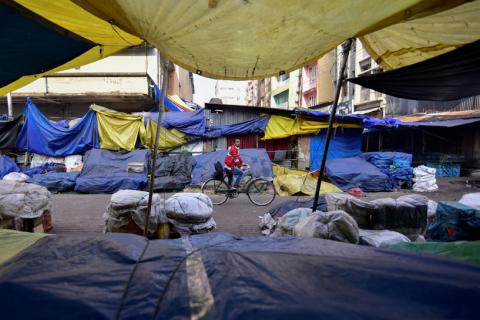 A man pedals his bicycle through a closed market during the strike called by All Assam Students Union (AASU) and the North East Students' Organisation (NESO) to protest against the government's bid to pass a bill in parliament to give citizenship to non-Muslims from neighbouring countries, in Guwahati, India, January 8, 2019. PHOTO BY REUTERS /Anuwar Hazarika